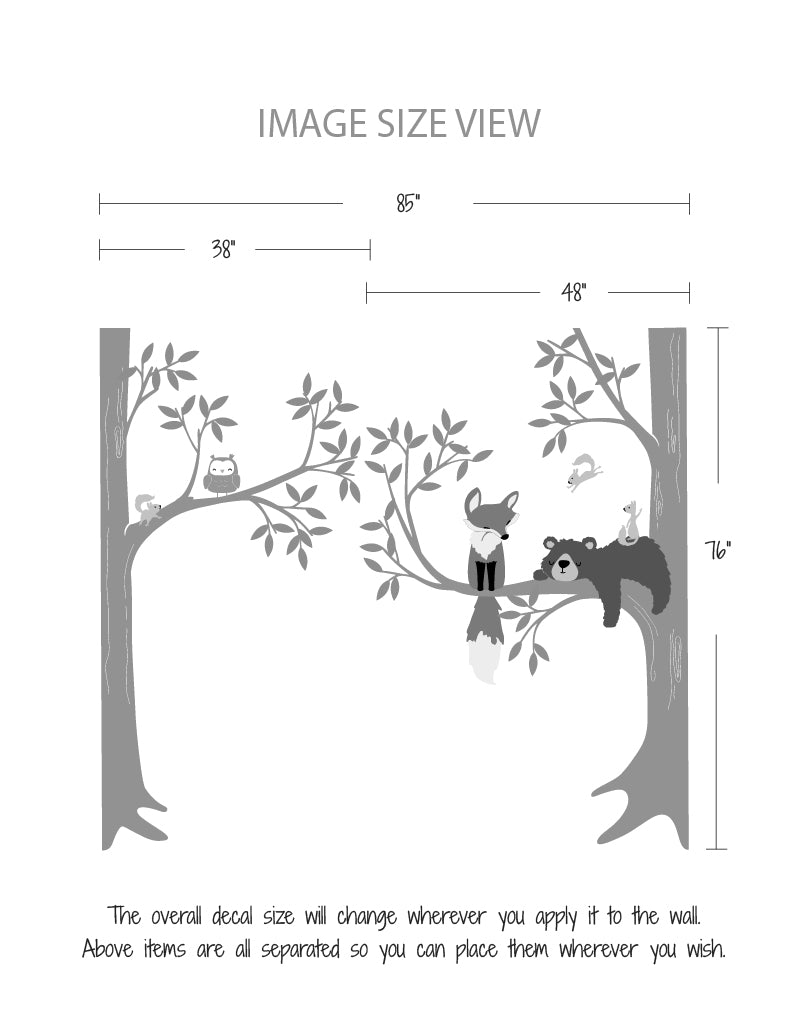 A wall decal featuring a bear, fox, owl, and squirrels in a woodland setting | www.pinknbluebaby.com
